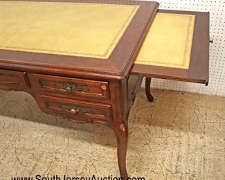 Lot 535
Baker Furniture country French walnut leather top faux partner style desk with pull out leather top writing boards on ends