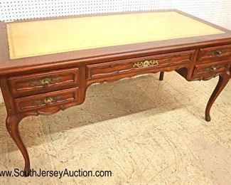 Lot 535
Baker Furniture country French walnut leather top faux partner style desk with pull out leather top writing boards on ends