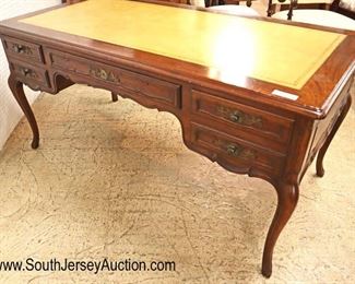 Lot 535
Baker Furniture country French walnut leather top faux partner style desk with pull out leather top writing boards on ends