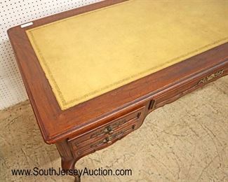 Lot 535
Baker Furniture country French walnut leather top faux partner style desk with pull out leather top writing boards on ends