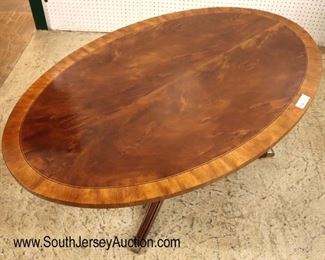 Lot 539: Ethan Allen Furniture burl mahogany and banded oval coffee table