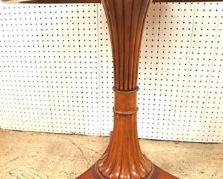 Lot 544
Ethan Allen Furniture burl mahogany and walnut round pedestal center table