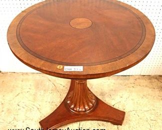 Lot 544
Ethan Allen Furniture burl mahogany and walnut round pedestal center table