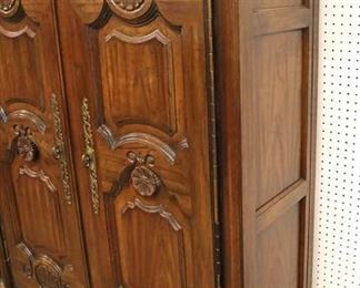 Lot 557
NICE QUALITY country French carved 2 door fitted interior armoire with panel sides in the manner of Baker Furniture