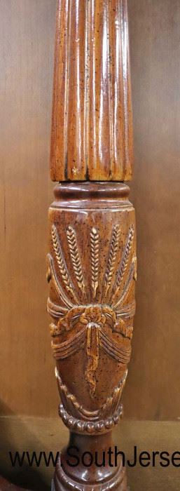 Lot 564
Traditional mahogany banded four poster carved queen size bed with rails