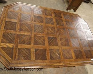 Lot 565
Thomasville Furniture country oak parquet top dining room table with (2) 16" leaves