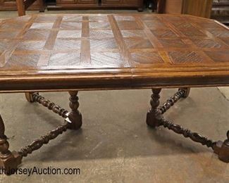 Lot 565
Thomasville Furniture country oak parquet top dining room table with (2) 16" leaves
