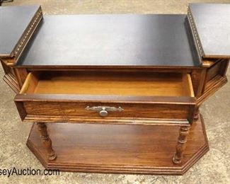 Lot 570
Thomasville Furniture country oak flip top server