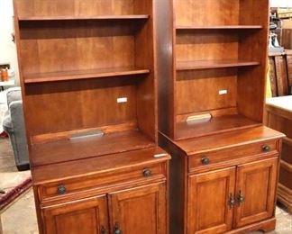 Lot 576
PAIR of 2 piece office credenza bookcases in the cherry finish