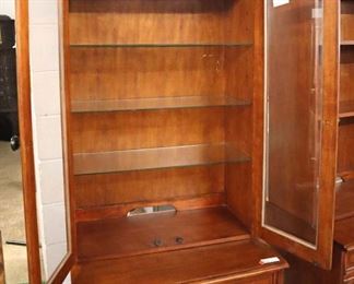 Lot 577
2 piece office file cabinet display cabinet with key in the cherry finish