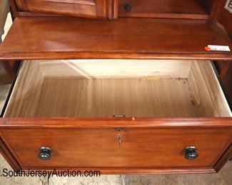 Lot 577
2 piece office file cabinet display cabinet with key in the cherry finish