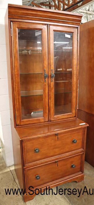 Lot 577
2 piece office file cabinet display cabinet with key in the cherry finish
