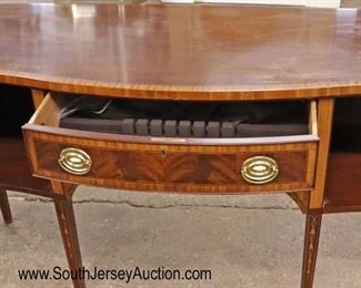 Lot 589
Councill Furniture mahogany banded and bell flower inlaid tamper leg sideboard