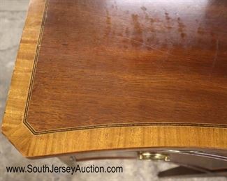 Lot 589
Councill Furniture mahogany banded and bell flower inlaid tamper leg sideboard