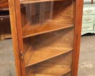 Lot 600
ANTIQUE oak corner cabinet with brass pineapple finials in the original finish with key