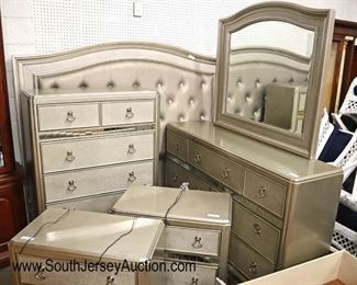 Lot 688: Coaster Furniture 6 piece Like New with tags polychrome style with decorative mirrors and upholstered king size jeweled button tuft headboard and under the bed storage bedroom set with rails and hardware - night stand has USB chargers - one night stand has water bubble - all decorative mirrors are good