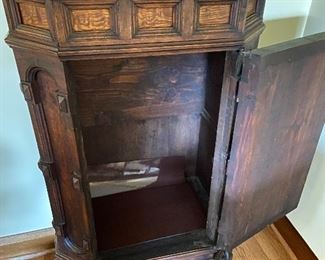 Interior of the lower portion of the case.  Above the door there is also a hidden drawer.