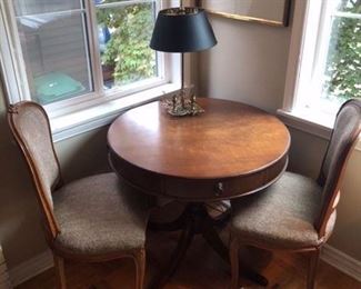 Antique mahogany drum table. Shown with pair of antique custom upholstered side chairs and Frederick Cooper table lamp. Table is a 32” dia. and 28.5” high. Asking $120 for the table.