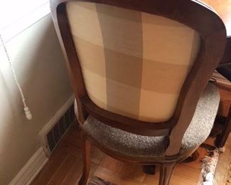 Silk accent on back of chair.