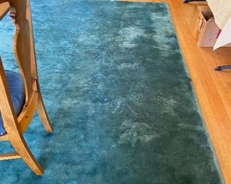 Antique wool and silk rug from China $360 9' 11' x 14' brought to the US by the owner's great grandfather on a clipper ship he captained.  The coloration spots are camera related not damage related.  Priced low becasue there are some small holes by old moth damage.