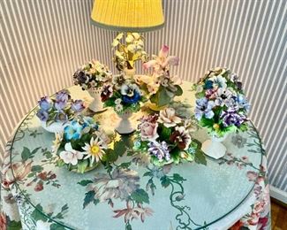 Collection of porcelain & bisque flowers  various makers   some chips    tallest 7"                                  