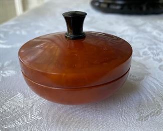 small bakelite jar      2"h x 2 1/2" diameter              30.00