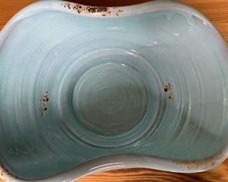 Light blue pottery bowl                                                                      6 1/2"h x 17 1/2" w x 9 1/4"d 
