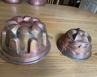 2 antique copper molds                                                            larger 4 1/2"h x 8" diameter                                                                        smaller 3 3/4" h x 6 1/8" diameter