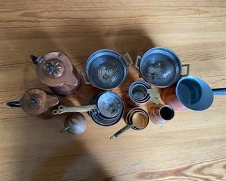 Collection of copper articles including: 2 miniature colanders, small pots, 3 setoff measuring cups, etc. height of largest piece 4 1/2"h                                  