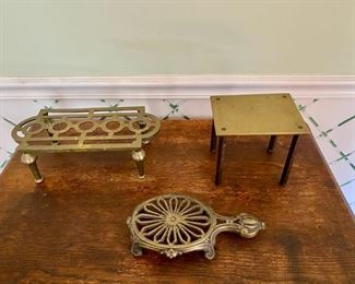 3 antique brass trivets                                                      95.00       table form 5 3/4"h, open work rectangular 4"h,             low oval form 1 1/2"h