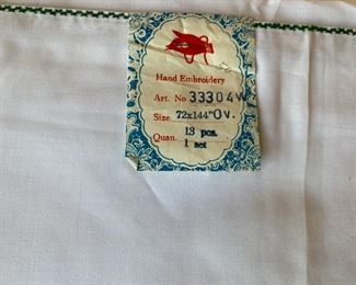 Vintage appliqué oval tablecloth New with tags  125.00              includes 12 napkins      never used