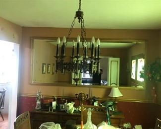 light fixtures and dinning room table and cabinet