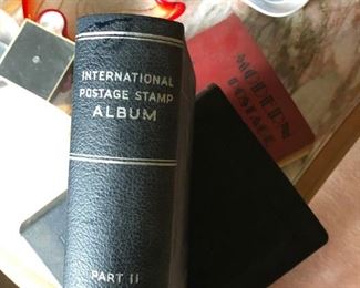 three stamp books and loose foreign  and American stamps too