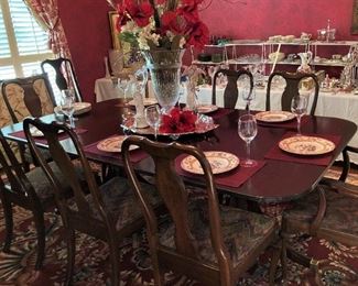 This very fine dining table was purchased in England and has 2 more leaves. The chairs (set of 4 and set of 8) are sold separately from the table.