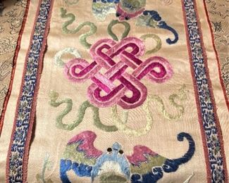 Intricate stitching on silk