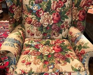 One of two matching custom-upholstered wingback chairs