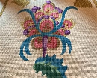 Each seat has a different needlepoint pattern