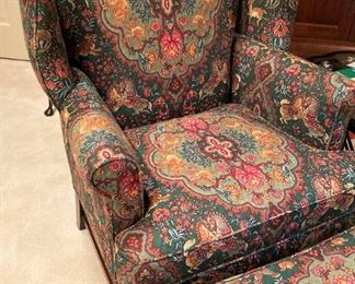 This wingback chair has a matching ottoman.