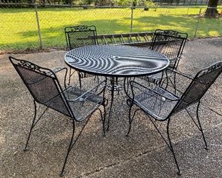 wrought iron patio table and 4 chairs