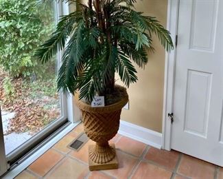 Lot 3160. $160.00.   Beautiful Faux Palm in Pedestal Composite Urn, really very nice! 7' tall x 4' wide
Pot: 19" diameter x 25" H