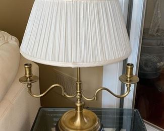 Lot 3161. $225.00  Wildwood Lamp made of Vintage Brass Double Light on top with 2 Candle Lamp arms.   The pleated shade is in a bit of rough shape. The finial is goofy, probably could use a new shade.  The lamp measures about 24" tall and the shade is 15" wide.  The lamp itself is great! A comparable Wildwood lamp new runs $1,100+.  Crazy!