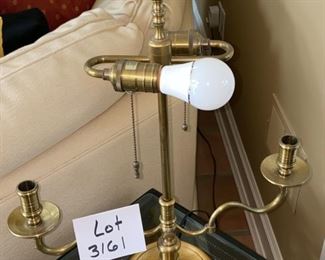 Lot 3161. $225.00  Wildwood Lamp made of Vintage Brass Double Light on top with 2 Candle Lamp arms.   The pleated shade is in a bit of rough shape. The finial is goofy, probably could use a new shade.  The lamp measures about 24" tall and the shade is 15" wide.  The lamp itself is great! A comparable Wildwood lamp new runs $1,100+.  Crazy!