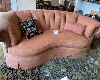 Lot 3175. 	$650.00 C.R. Laine in Hickory, N.C. Kidney Shaped Sofa was $2000 new! In a heathered rust color. 92"w 48"d x 35"t 18" seat height. This room is typically very sunny, and the tops of the sofa are a tad faded, but not problematic.  