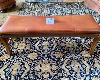 Lot 3181. $150.00  American Drew Leather Bench, has been repaired,  after a 300 lb. relative sat on it and broke it!  Poor guy.   You may want to reinforce the repair, because the bench is gorgeous and great for extra seating.  52"W x 16"D x 19"H.  We priced as is.  