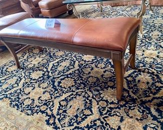 Lot 3181. $150.00  American Drew Leather Bench, has been repaired after a 300 lb. relative sat on it and broke it!  Poor guy.   You may want to reinforce the repair because the bench is gorgeous and great for extra seating.  52"W x 16"D x 19"H.  We priced as is.  