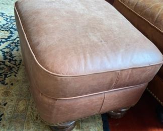 Lot 3182. $525.00  1 of 2 Classic Leather Chair and Ottoman with nailhead trim detail. Was $1950 new! Medium Brown	chair: 40"H to back x 29"D x 39"W  Seat: 19"H x 20"W x 22"D;  Ottoman: 22"w x 21"x 17"H	Note that the ottoman is quite faded and worn, however, there is a product on the market that will restore this leather to its original luster.  Set looks better than what it looks like in this bright location.  