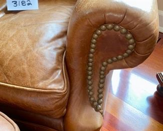 Lot 3182. $525.00  1 of 2 Classic Leather Chair and Ottoman with nailhead trim detail. Was $1950 new! Medium Brown	chair: 40"H to back x 29"D x 39"W  Seat: 19"H x 20"W x 22"D;  Ottoman: 22"w x 21"x 17"H	Note that the ottoman is quite faded and worn, however, there is a product on the market that will restore this leather to its original luster.  Set looks better than what it looks like in this bright location.  