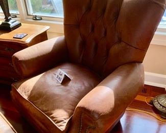 Lot 3183. $525.00   2 of 2 Classic Leather Chair and Ottoman with nailhead trim detail. Was $1950 new! Medium Brown	chair: 40"H to back x 29"D x 39"W  Seat: 19"H x 20"W x 22"D;  Ottoman: 22"w x 21"x 17"H	Note that the ottoman is quite faded and worn, however, there is a product on the market that will restore this leather to its original luster.  Set looks better than what it looks like in this bright location.  