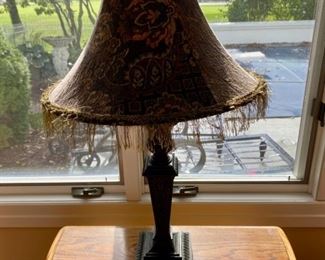 Lot 3185.  $125.00   Beautiful Metal Lamp with a fringed tapestry shade, from Walter E Smithe  34"tall	