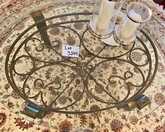 Lot 3204. $325.00 Gorgeous Oval Coffee Table with rounded beveled glass edge. gold-accented wrought iron base	49"W x 37"D x 19"H	  A good size, and we recommend this table, especially if you have a good looking rug underneath it.  Really opens up a room!